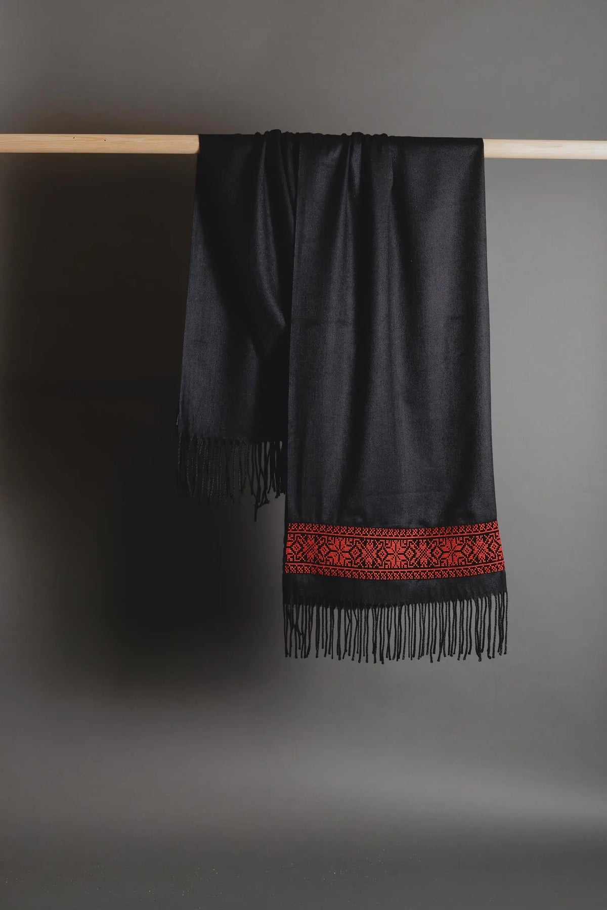 Black Palestinian tatreez embroidered scarf with red star tatreez by Mona Al Kurdi