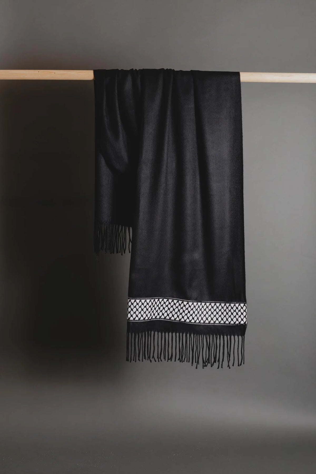 Black Palestinian tatreez embroidered scarf with keffiyeh-pattern tatreez by Mona Al Kurdi