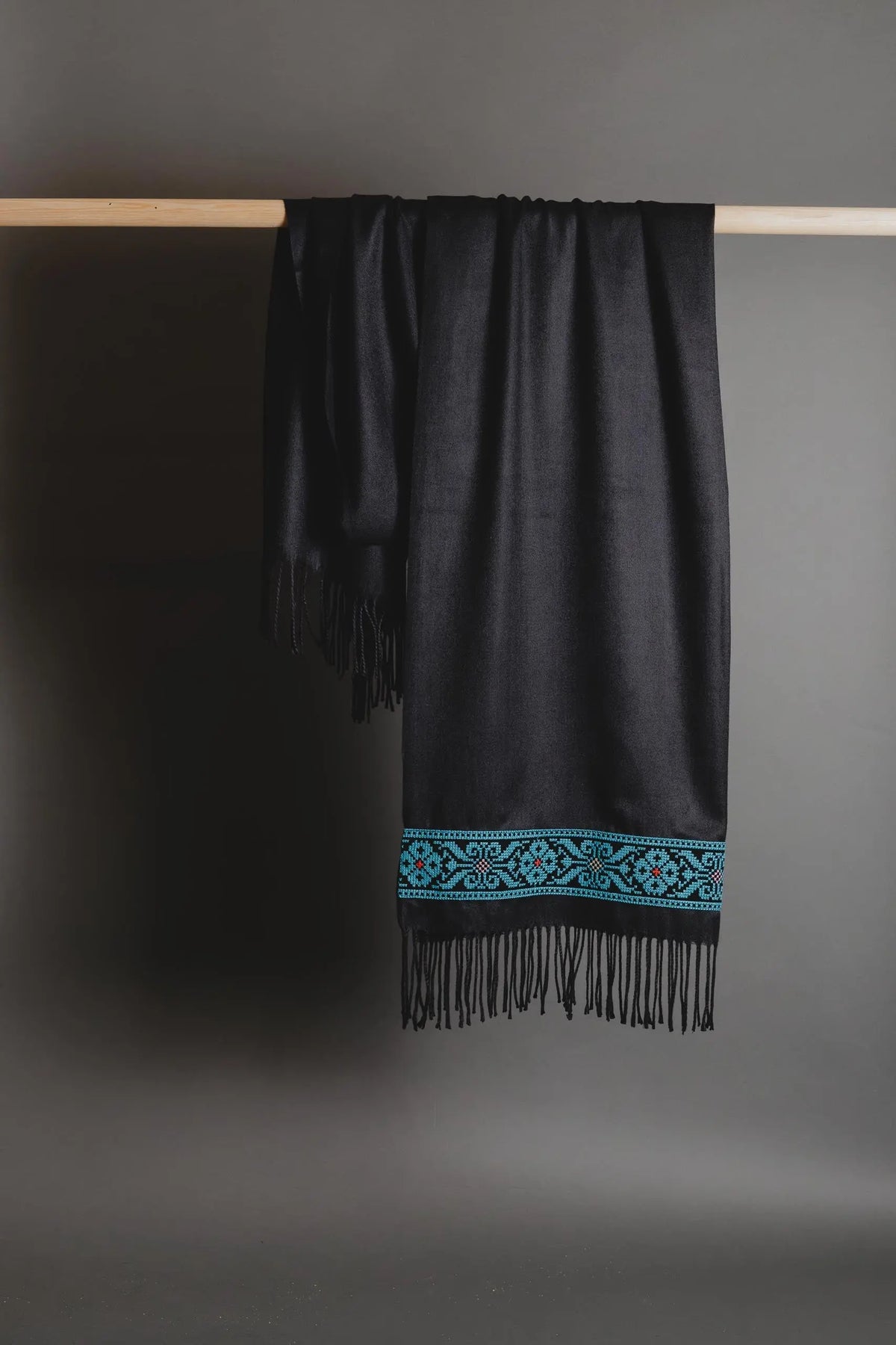 Black Palestinian tatreez embroidered scarf with blue flower tatreez by Mona Al Kurdi