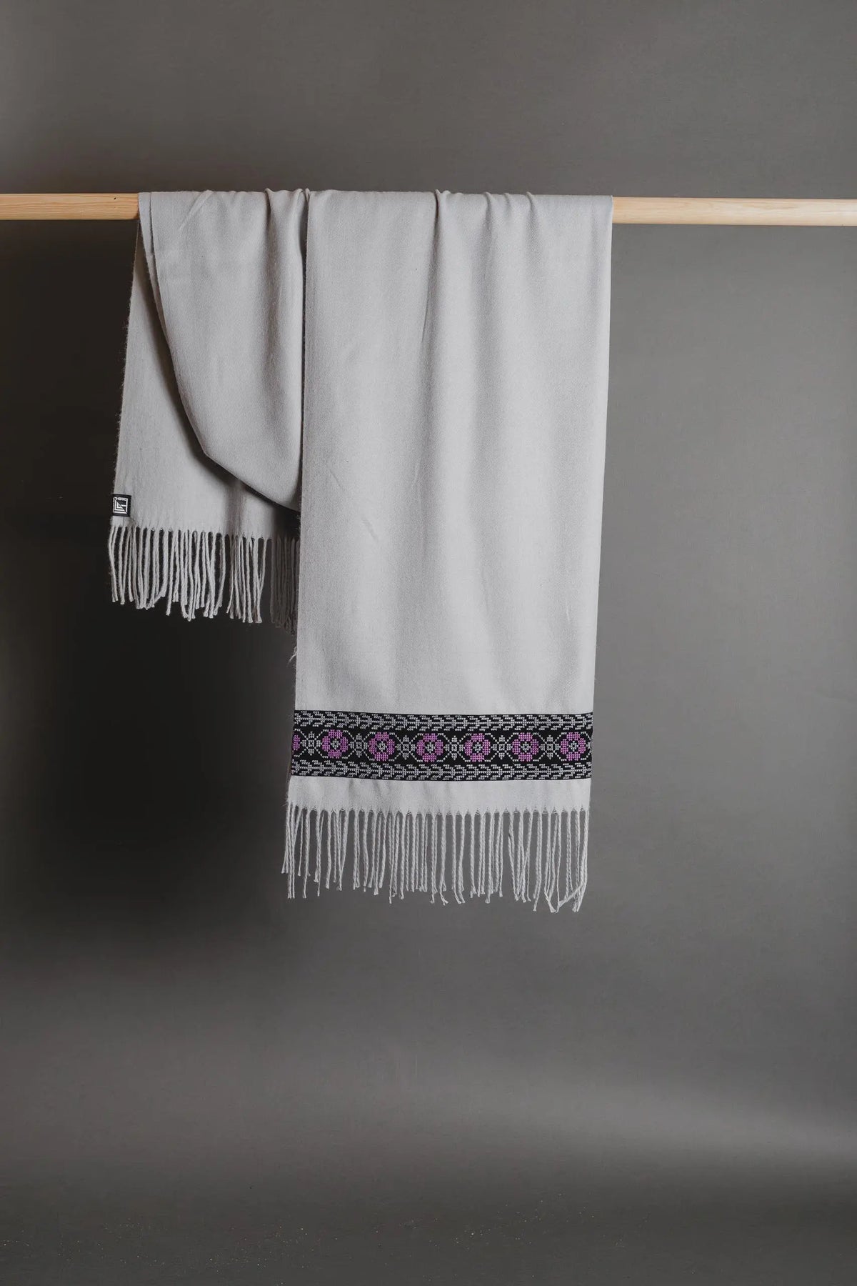 Grey Palestinian tatreez embroidered scarf with purple poppy tatreez by Mona Al Kurdi