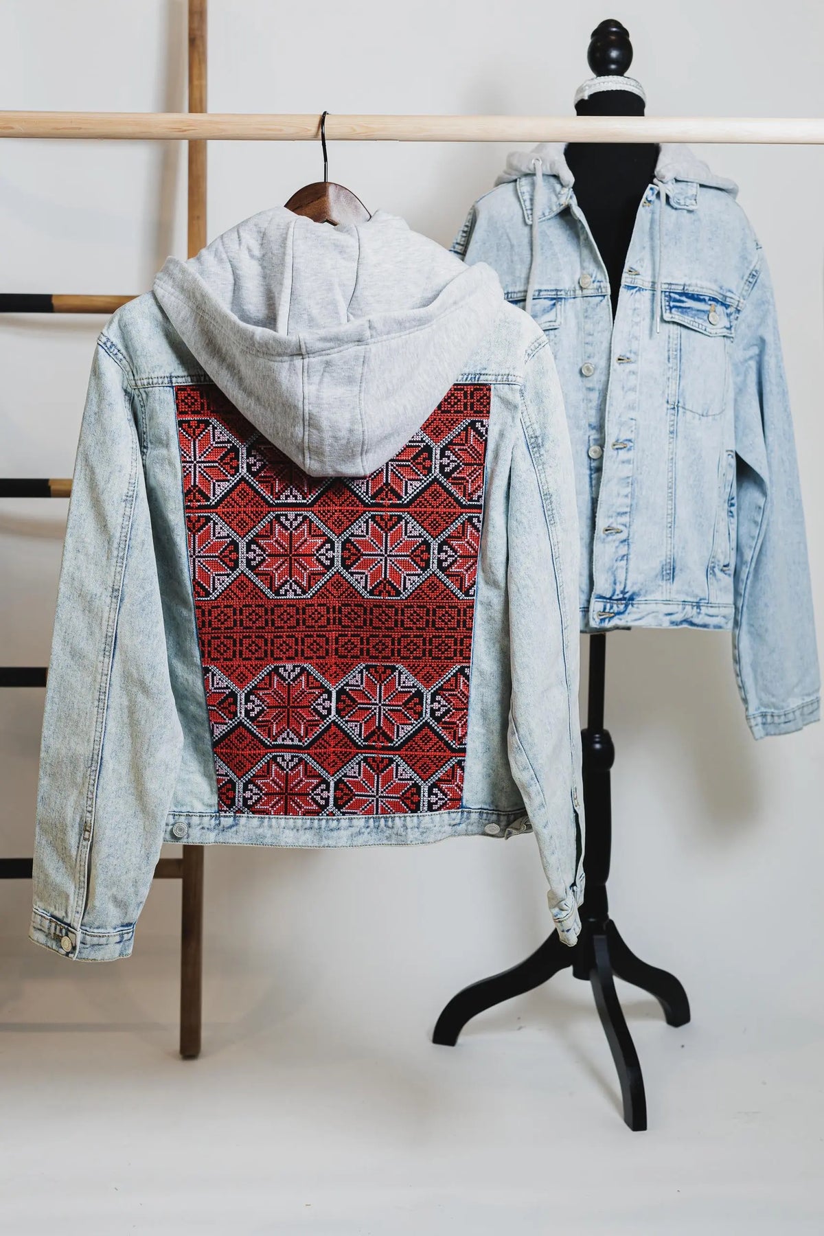 Unisex light blue denim jacket with Palestinian Tatreez embroidery on back