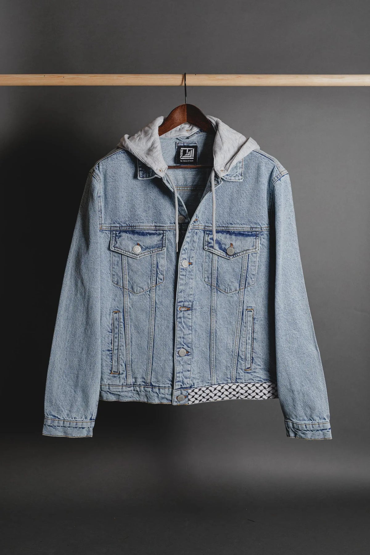 Close-up of authentic tatreez and keffiyeh embroidery on the back of the jacket