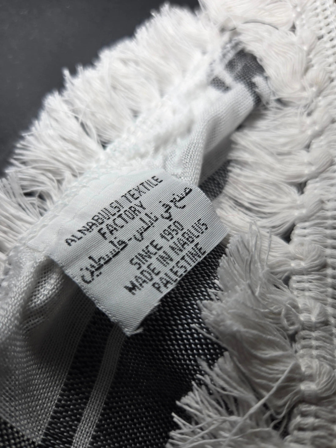 Al Nabulsi Classic Keffiyeh made in Palestine, draped as a scarf