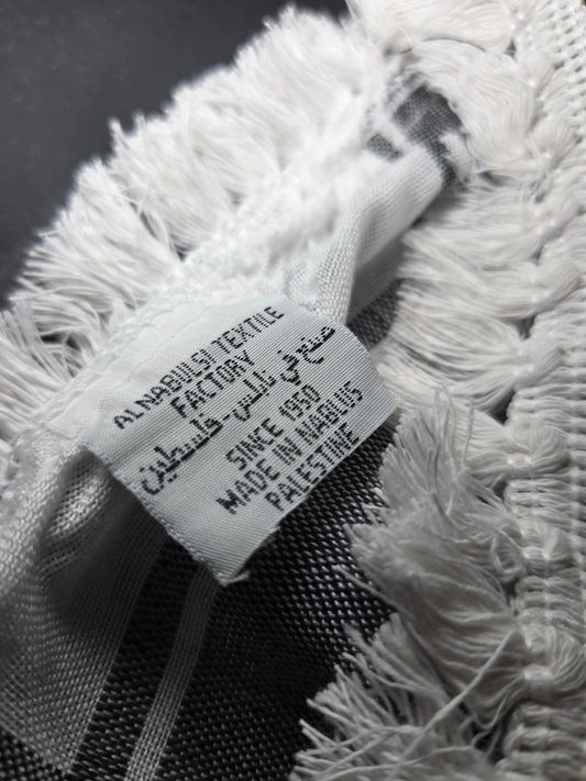 Al Nabulsi Classic Keffiyeh made in Palestine, draped as a scarf