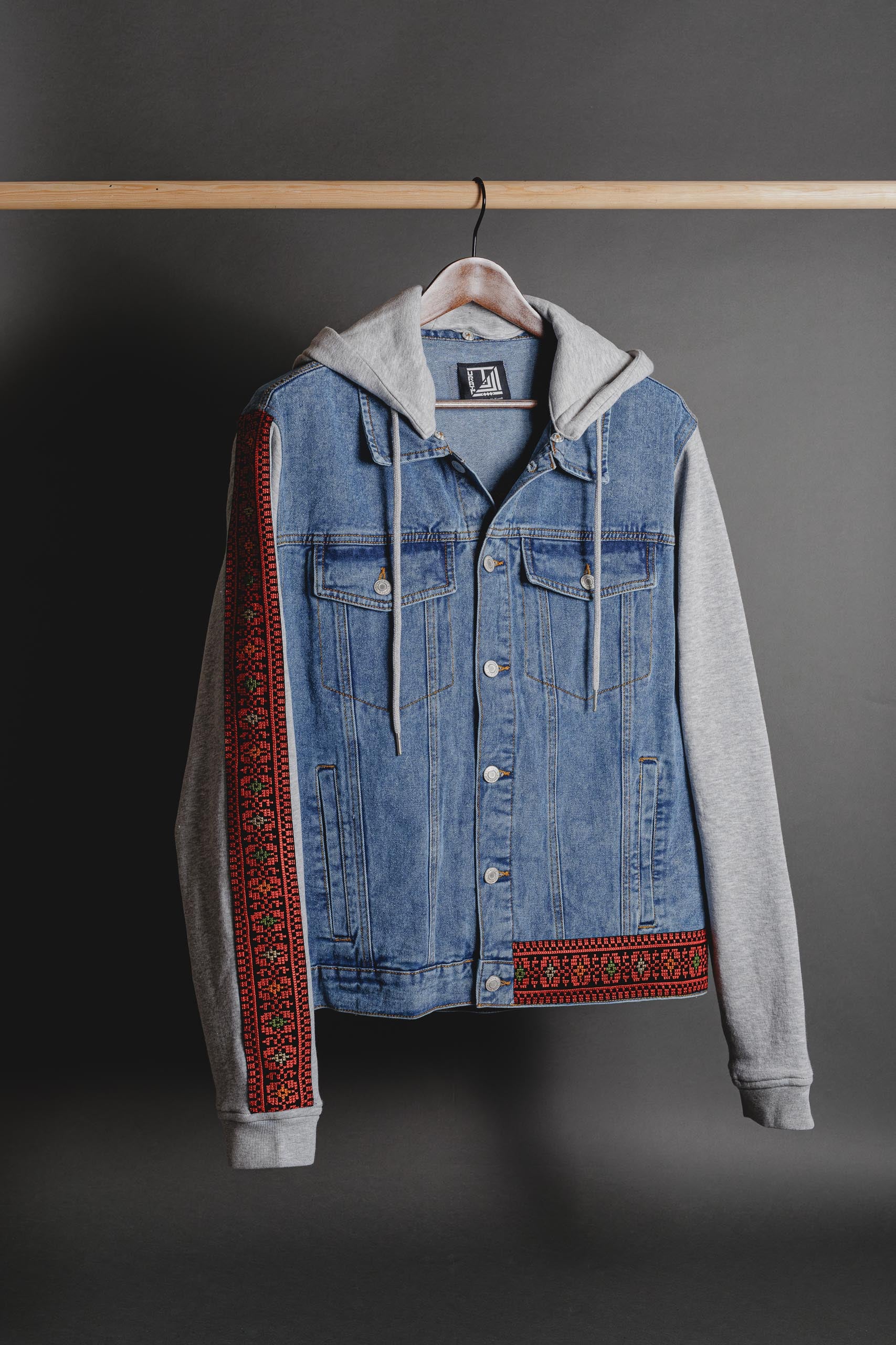 Denim jacket with fleece sleeves and Palestinian Tatreez embroidery, unisex streetwear by Turath Fashion