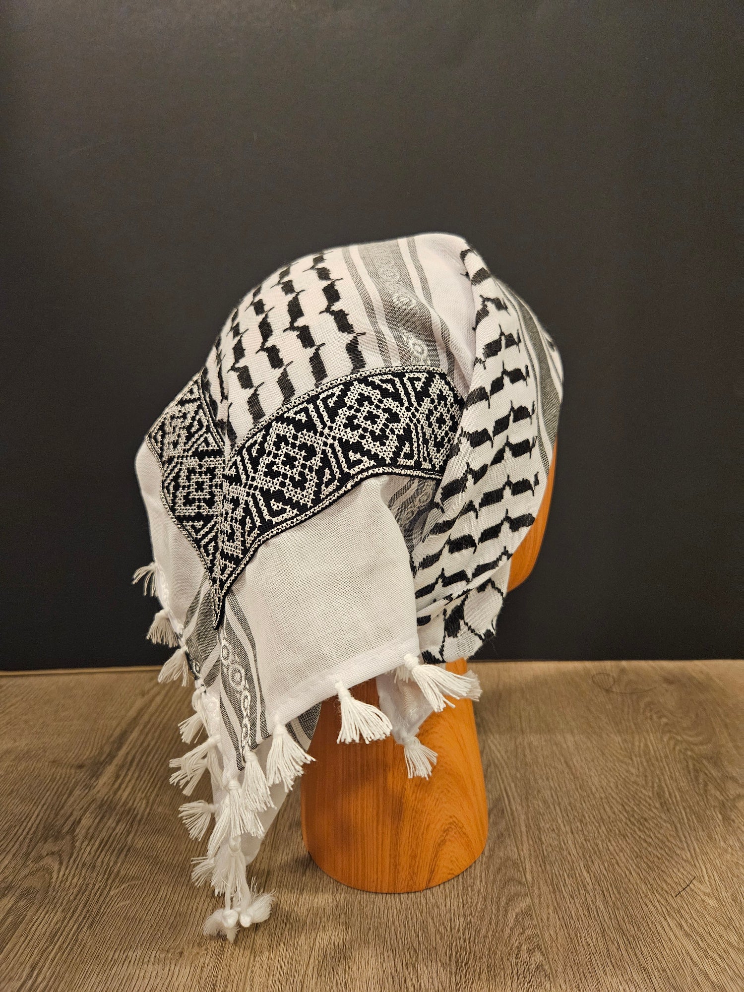 Classic white keffiyeh bandana with traditional Tatreez embroidery, symbolizing Palestinian heritage and cultural pride