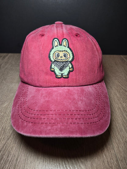 Dark pink cap featuring the Labubu cartoon character, embroidered design that adds a playful and unique touch