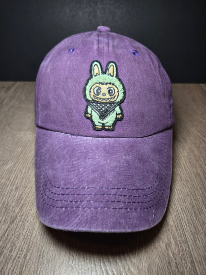 Dark purple cap featuring the Labubu cartoon character, a bold embroidered design for a playful and unique look.