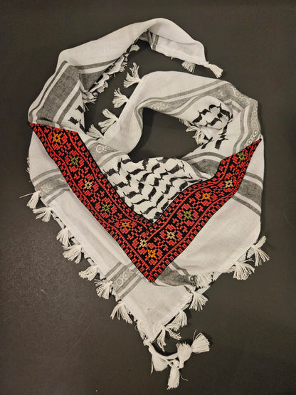 Decorative keffiyeh bandana with intricate Tatreez embroidery, combining cultural heritage with modern style for a unique accessory