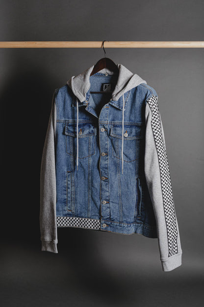 Front view of denim jacket with fleece sleeves and Palestinian Tatreez embroidery by Turath Fashion