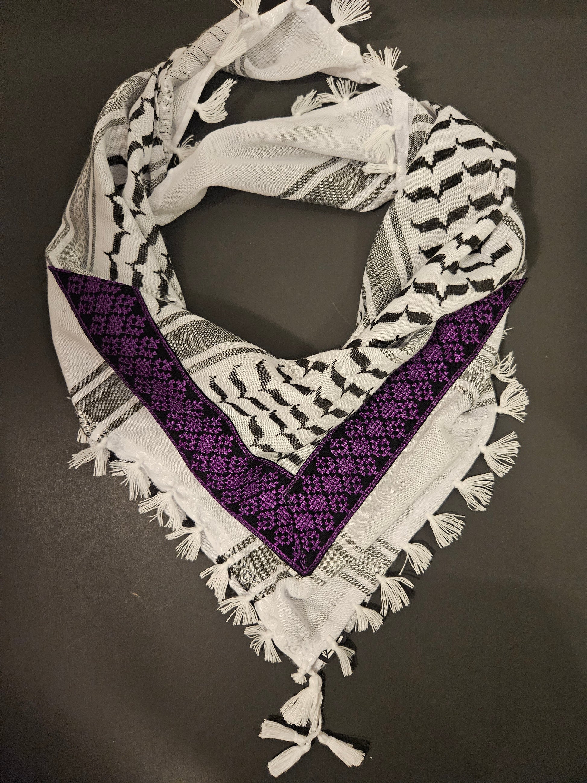 Purple keffiyeh bandana with Tatreez embroidery, a colorful and meaningful accessory showcasing Palestinian culture.