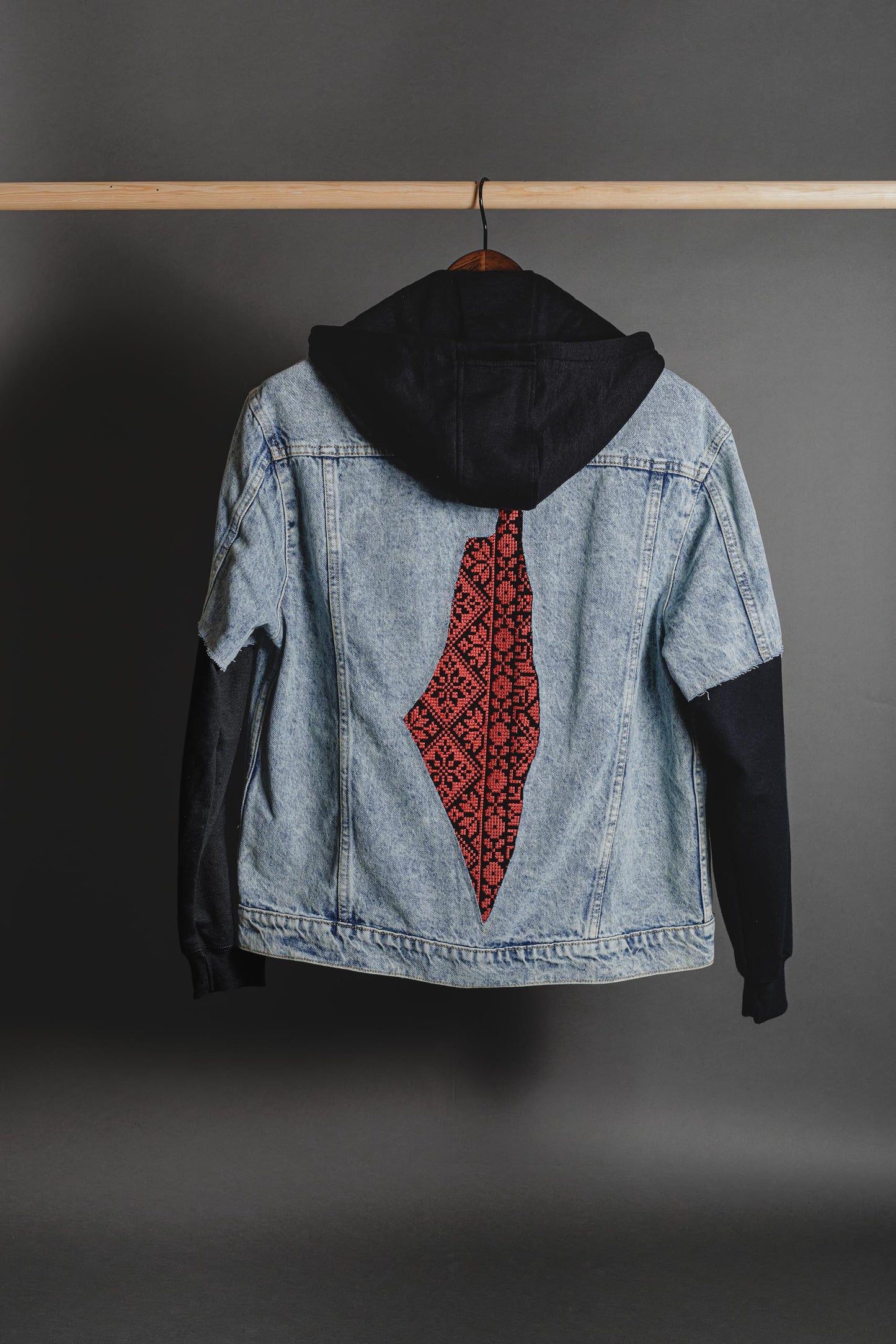 Front view of denim jacket with hand-cut Palestine map and tatreez details