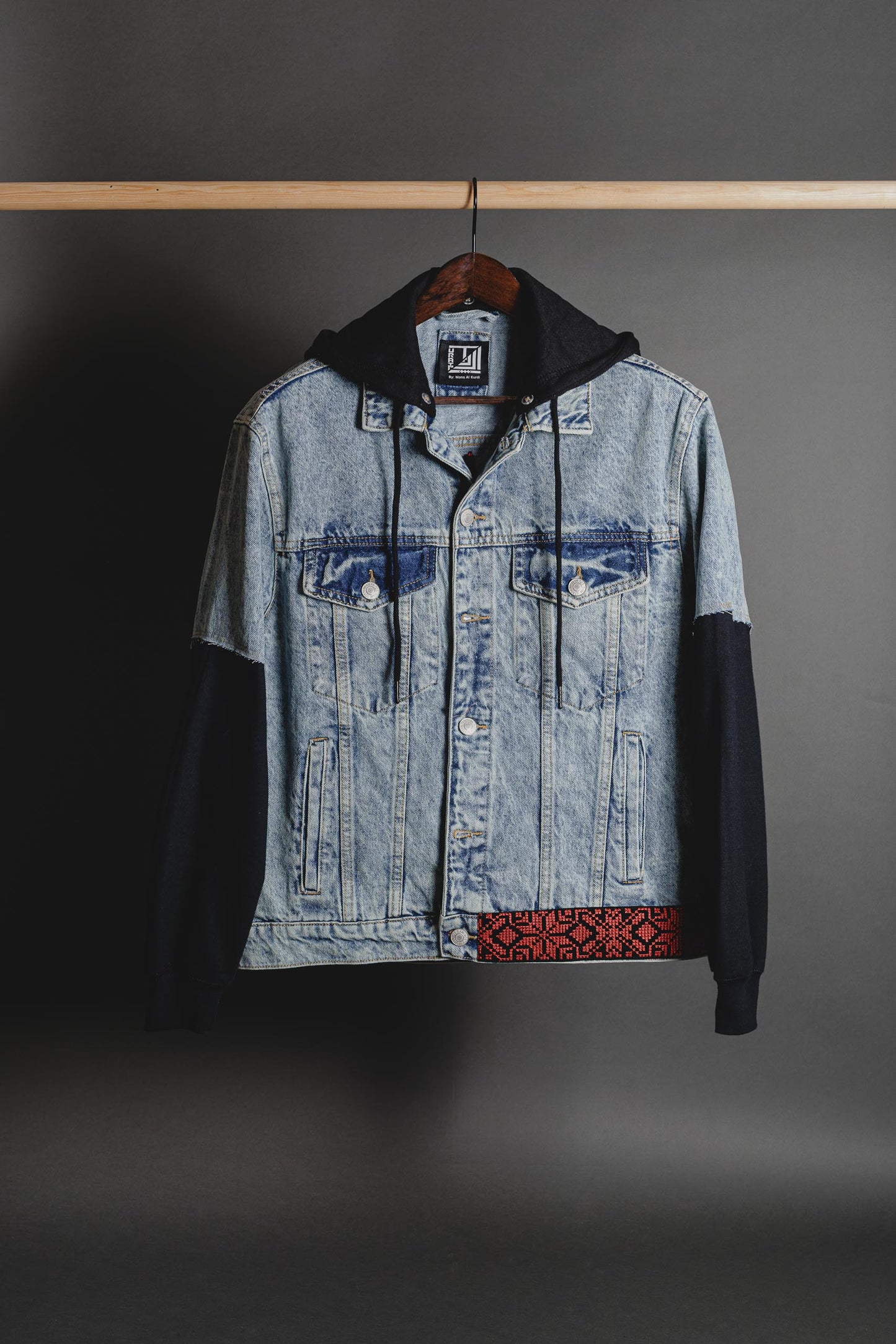 Front view of sweatshirt with denim sleeves and Palestine map applique