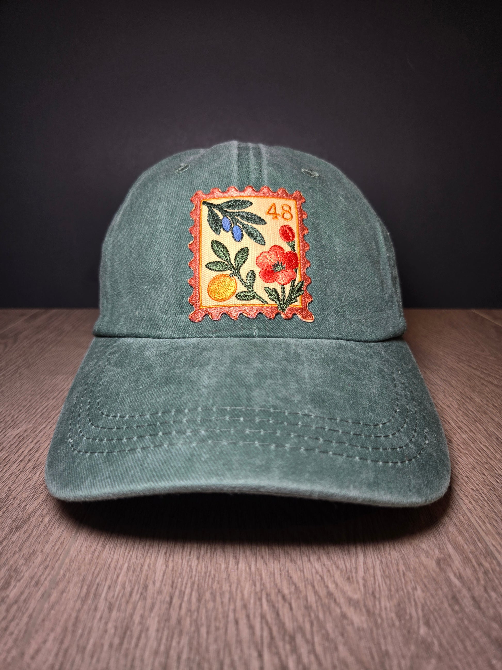 Gray unisex cap with embroidered Palestine postage stamp featuring floral design and the number 48