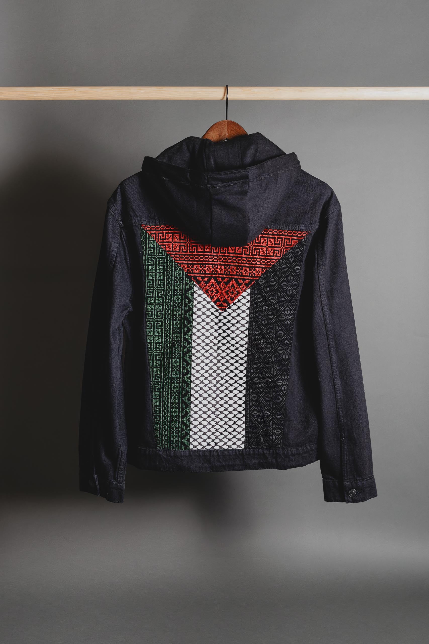 Front view of Palestinian Keffiyeh denim jacket with detachable hood and unisex fit