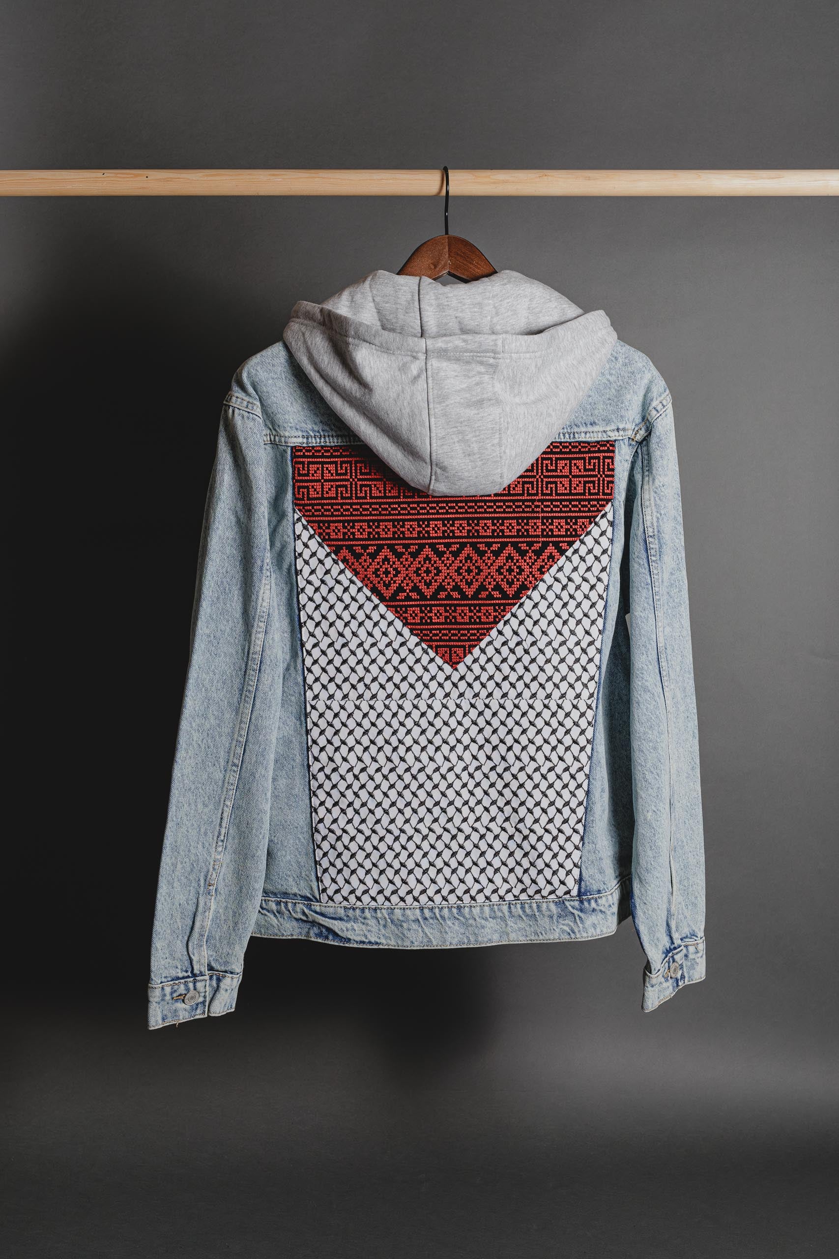 Unisex styled look of Palestinian Keffiyeh denim jacket worn for cultural streetwear