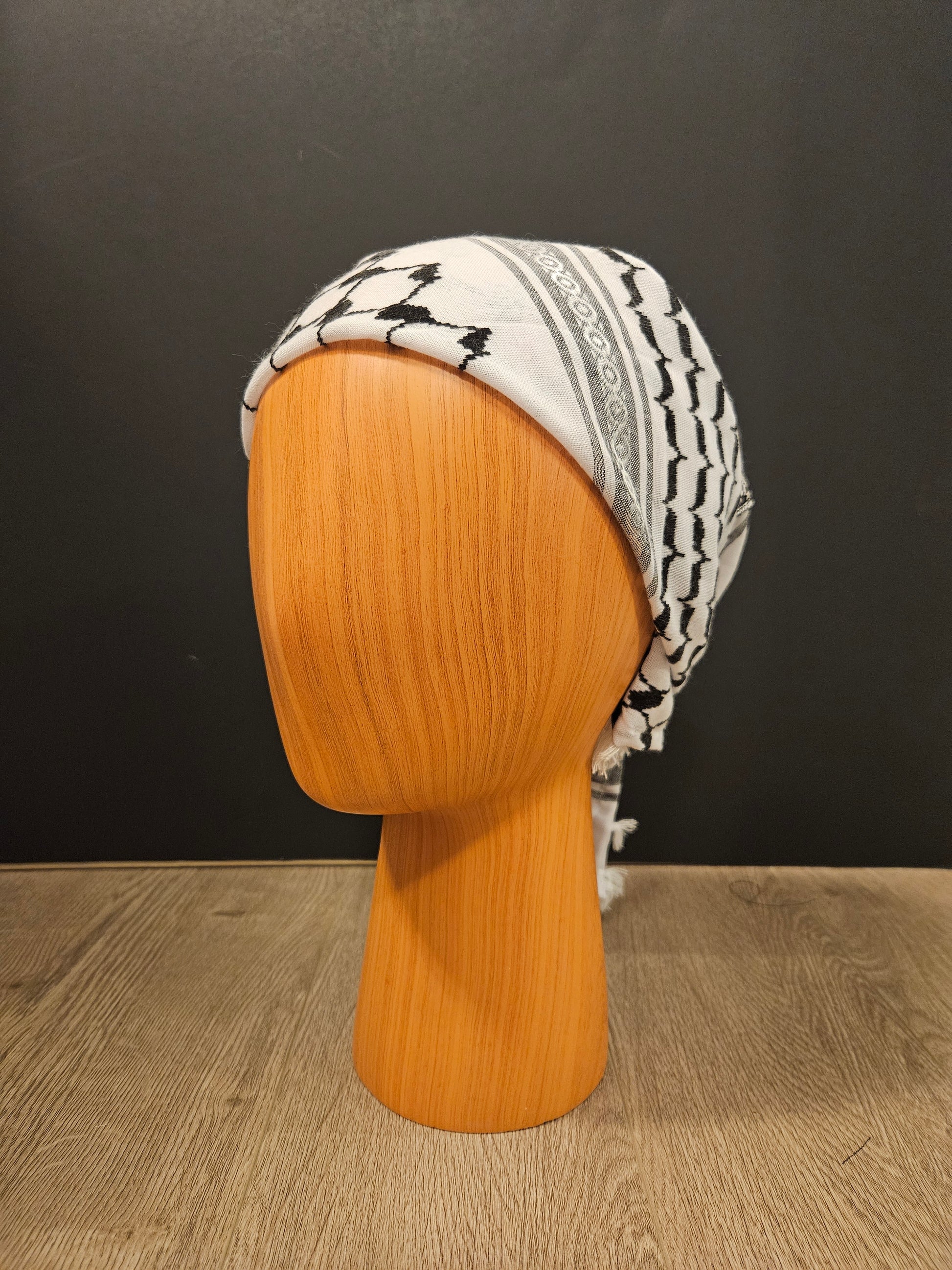 Elegant white keffiyeh bandana featuring traditional Tatreez embroidery, representing Palestinian culture and timeless heritage