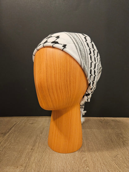 Elegant white keffiyeh bandana featuring traditional Tatreez embroidery, representing Palestinian culture and timeless heritage