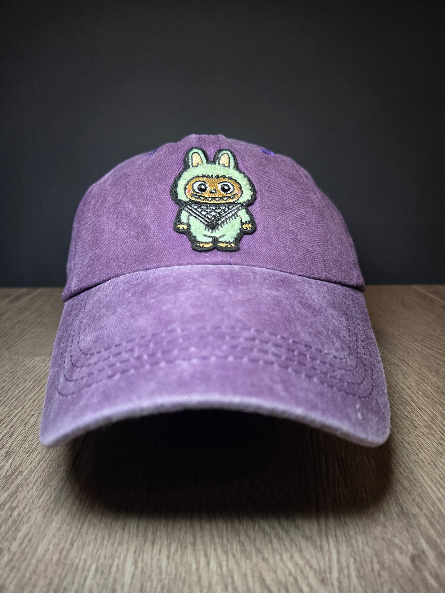 Purple bucket hat with embroidered Palestinian design, representing cultural pride and heritage